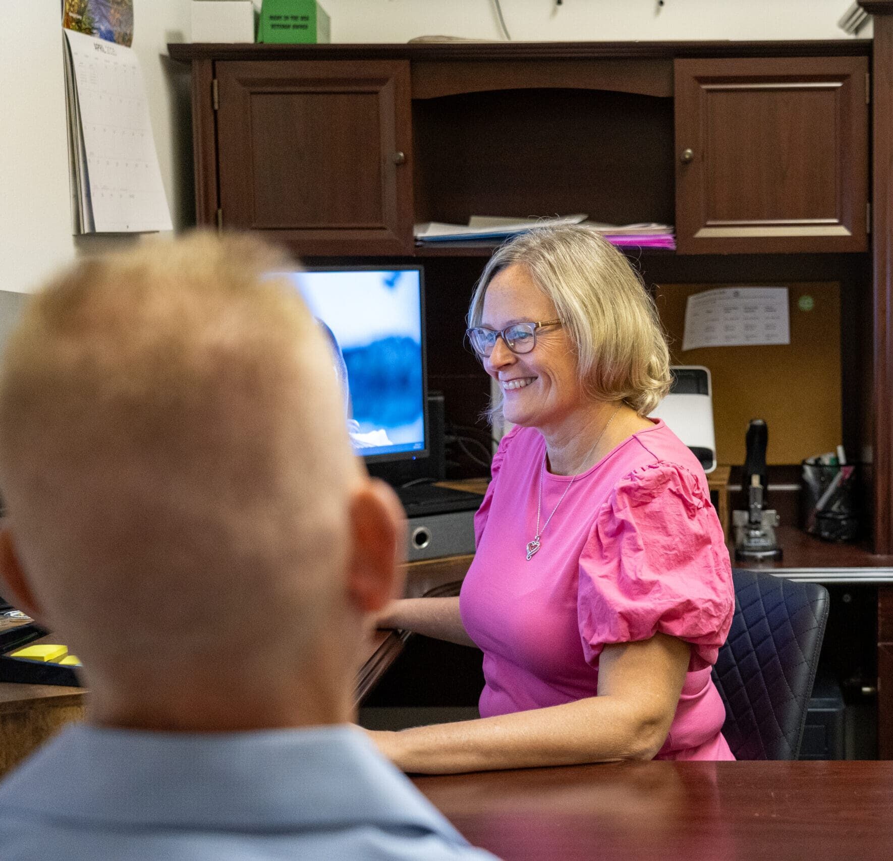 Financial consultant meeting with clients in the Petri Financial Services office Financial consultant meeting with clients in the Petri Financial Services office
