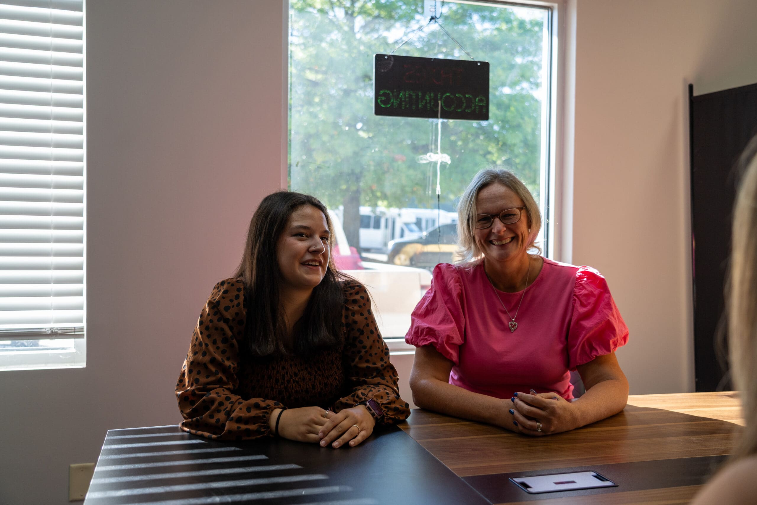 Staff members meeting with a client inside the Petri Financial Services office Staff members meeting with a client inside the Petri Financial Services office